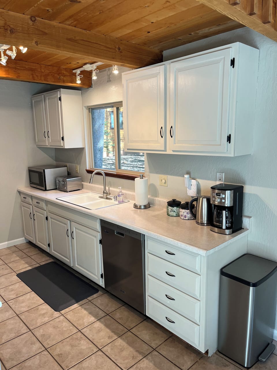 Full kitchen with dishwasher, coffee maker, microwave, and more