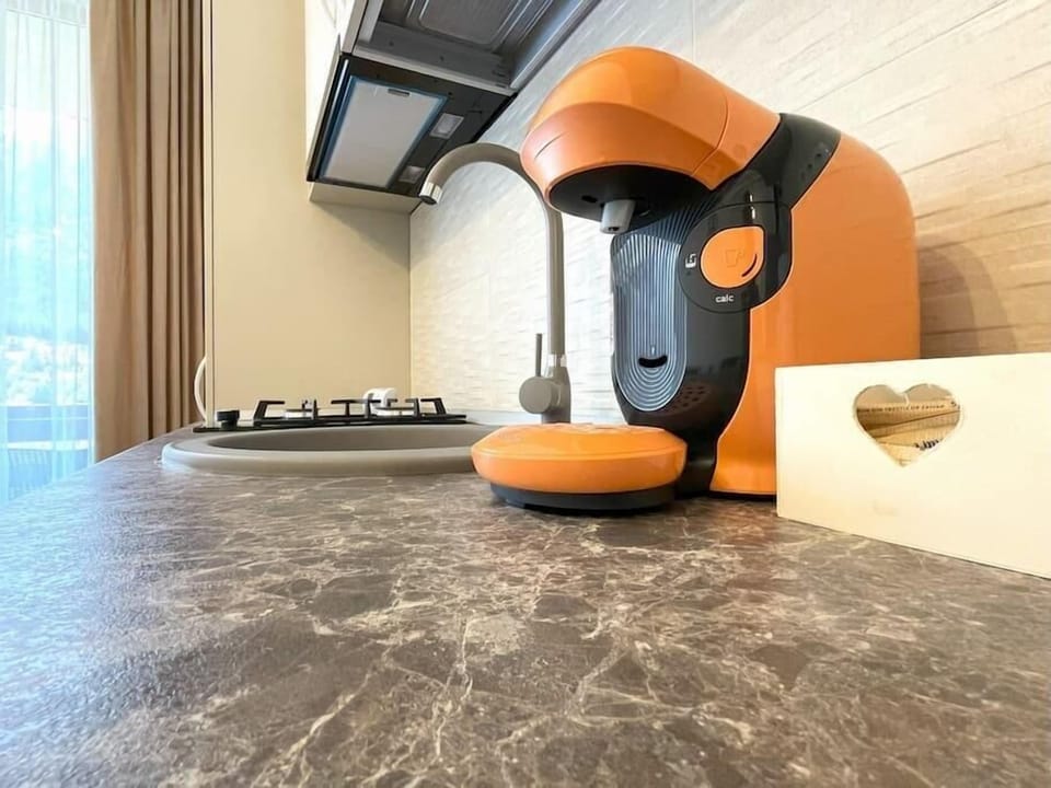 Nespresso machine in the modern open-space kitchen 