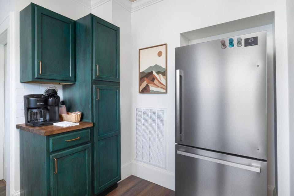Prepare meals with ease in this thoughtfully stocked kitchen with modern amenities.