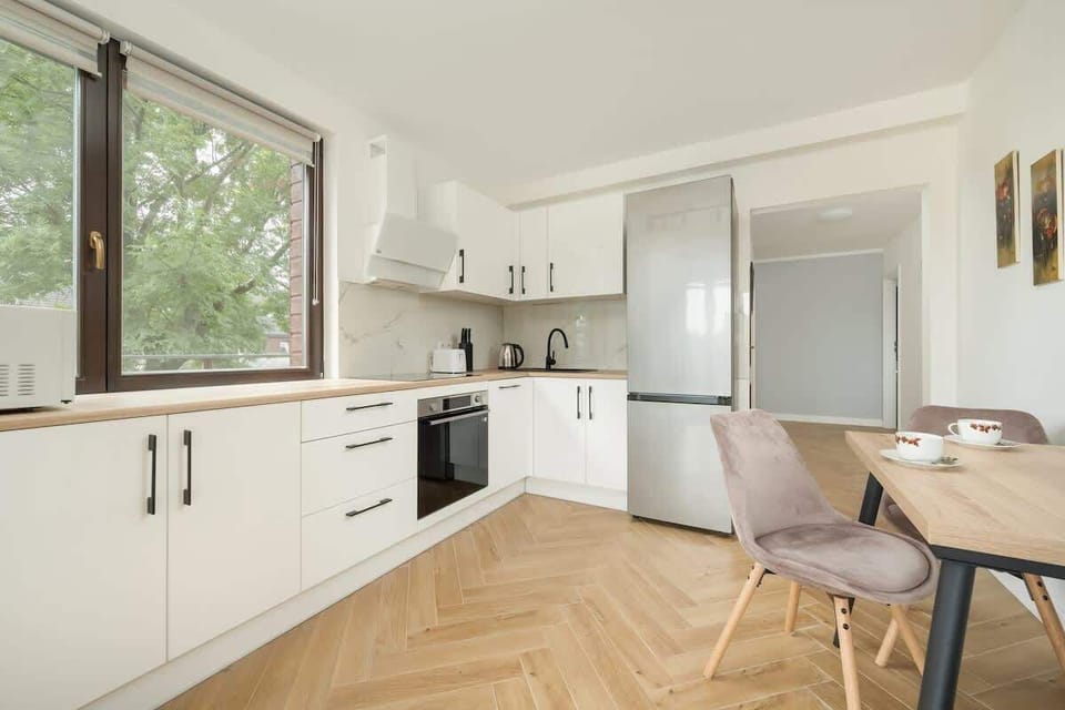 The sleek design of the kitchenette blending seamlessly with the living area.