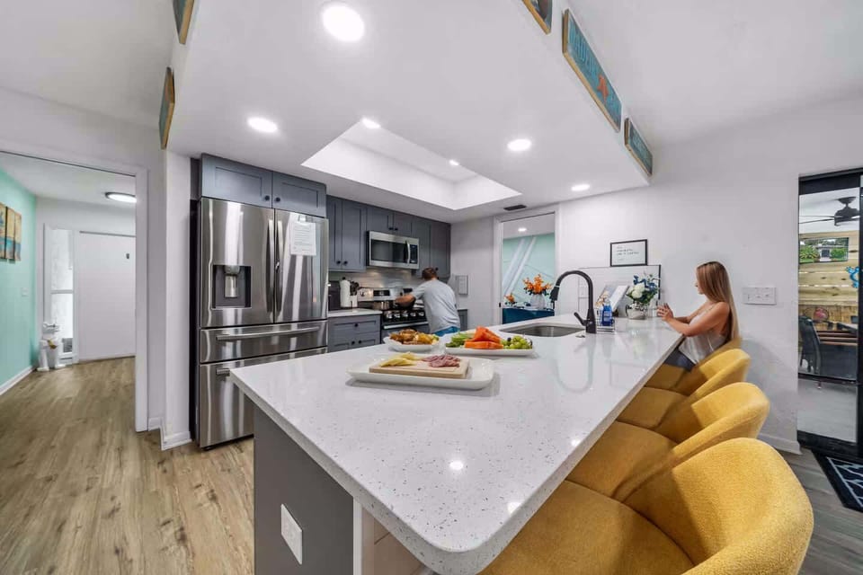 Gather in the heart of the home with a fully equipped modern kitchen and spacious island seating. Perfect for cooking family meals, sharing snacks, or relaxing together after a fun-filled day on Florida’s Gulf Coast. #MultiFamilyVacation