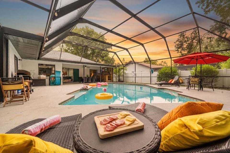 Relax with poolside snacks as the sun sets over your private heated pool. Comfy loungers, fun floats, and plenty of space make this Largo retreat the perfect spot for families to unwind and create stress-free vacation memories together.