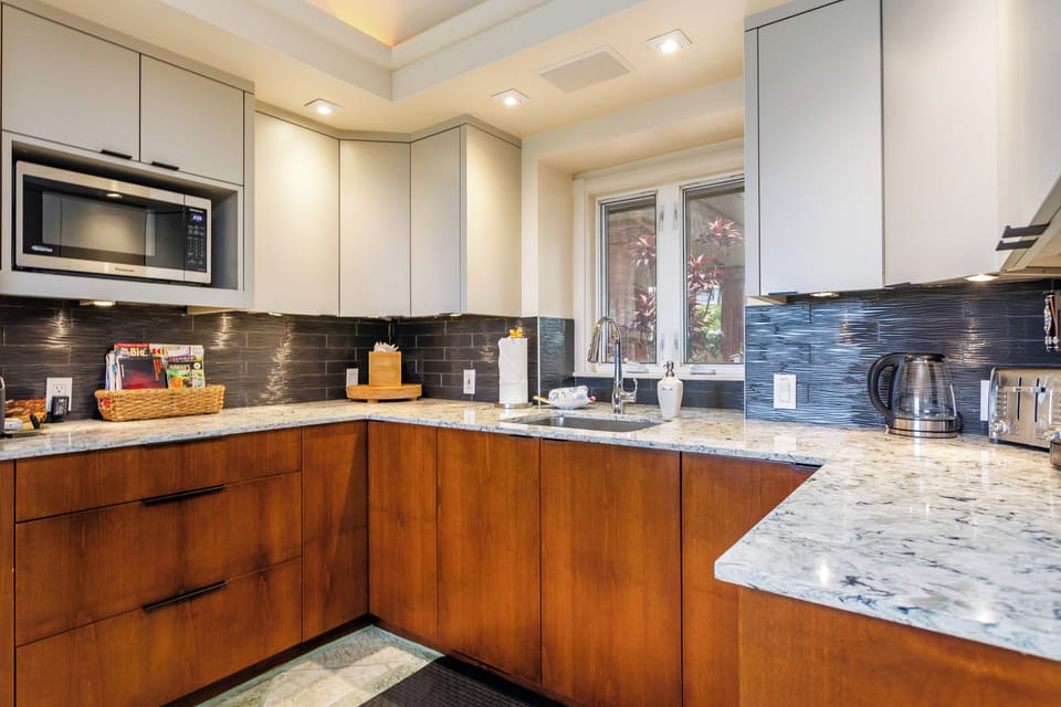 Your fully-equipped gourmet kitchen features sleek granite countertops, modern appliances, and everything you need to prepare delicious meals during your stay.