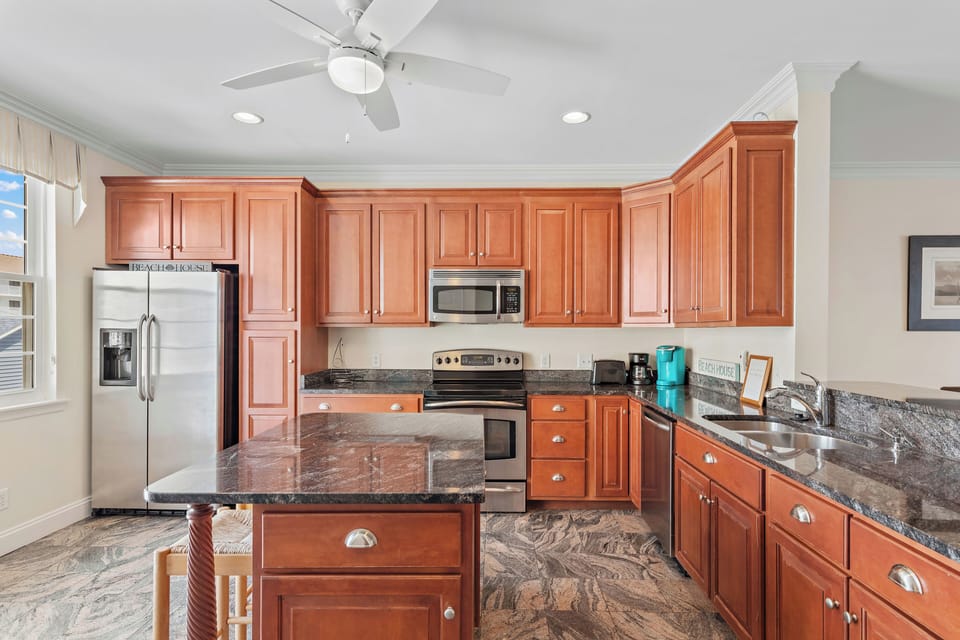The Chef in the family will appreciate the well-stocked Kitchen with spacious Countertops.