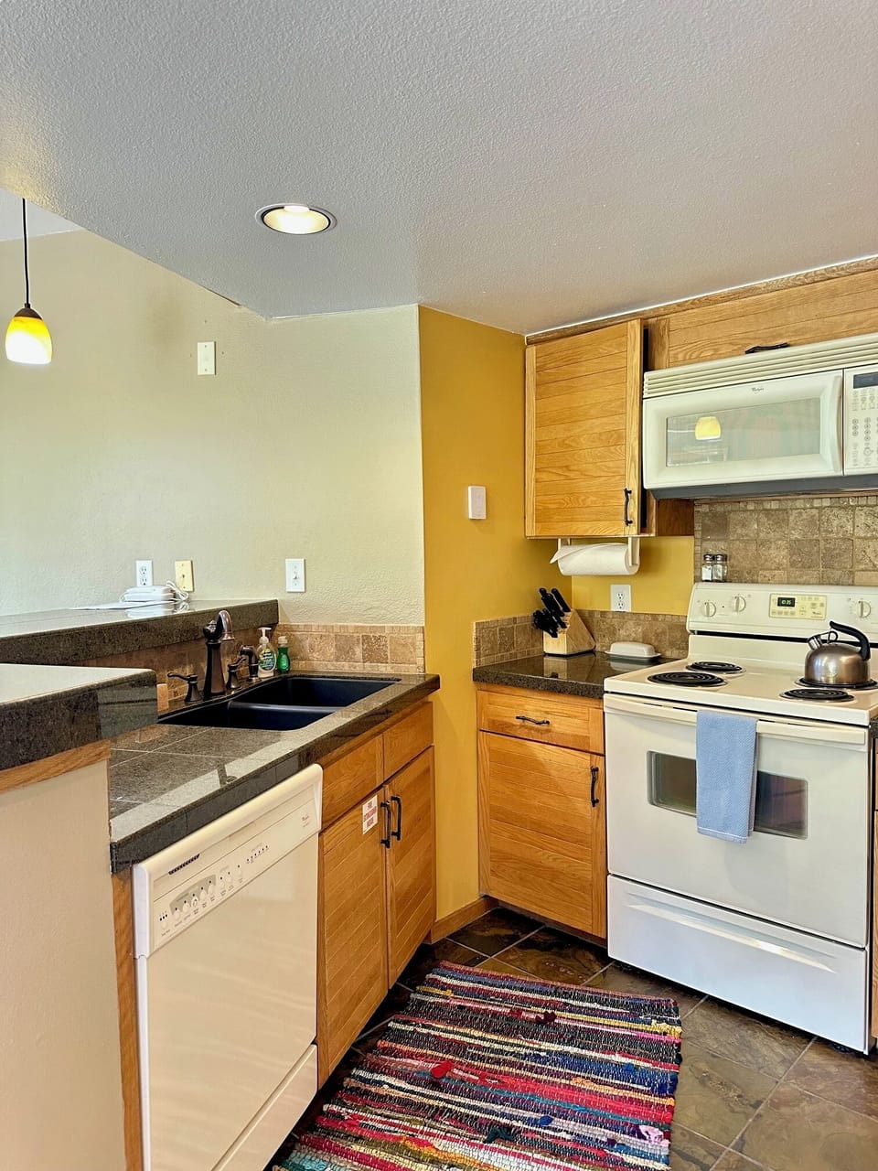 Well stocked kitchen with regular drip coffee maker