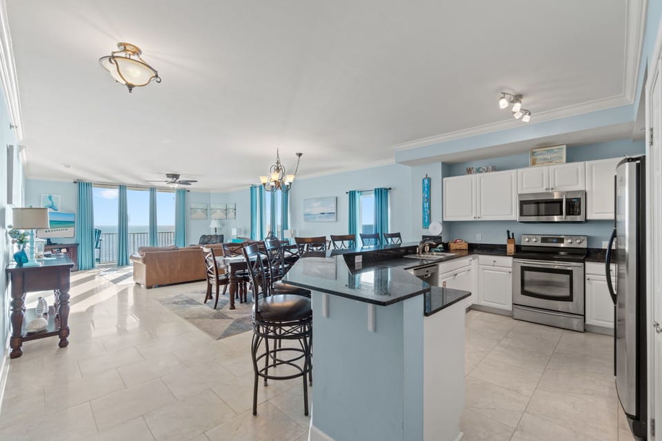 The kitchen-dining-living room open-floor plan provides a good flowing space.