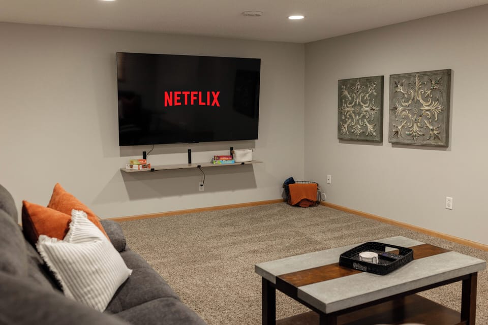 Have the ultimate movie night on the 85" smart tv and large, reclining sectional