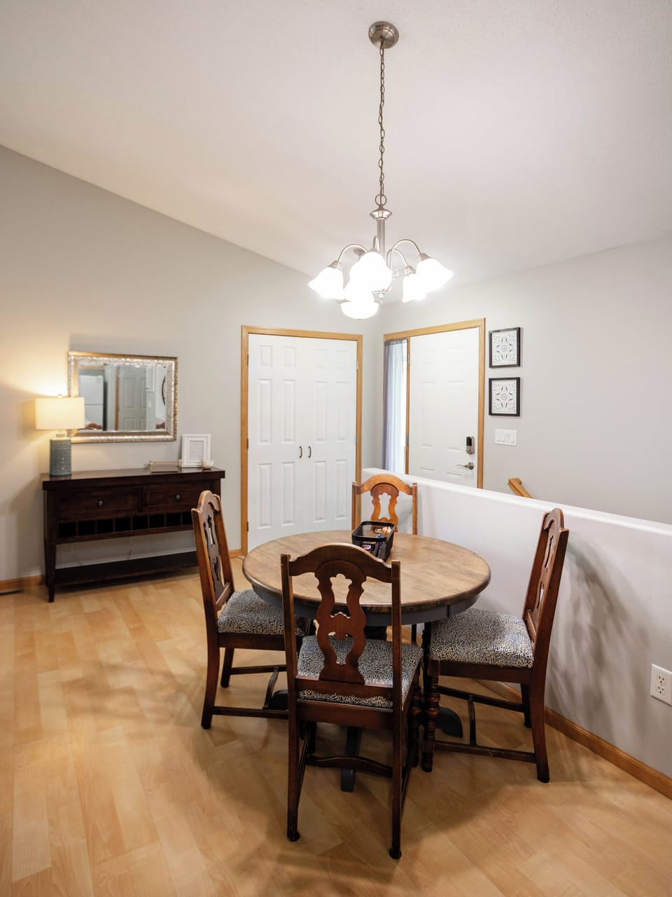 The dining table can accommodate 8 with a leaf, additional chairs downstairs.