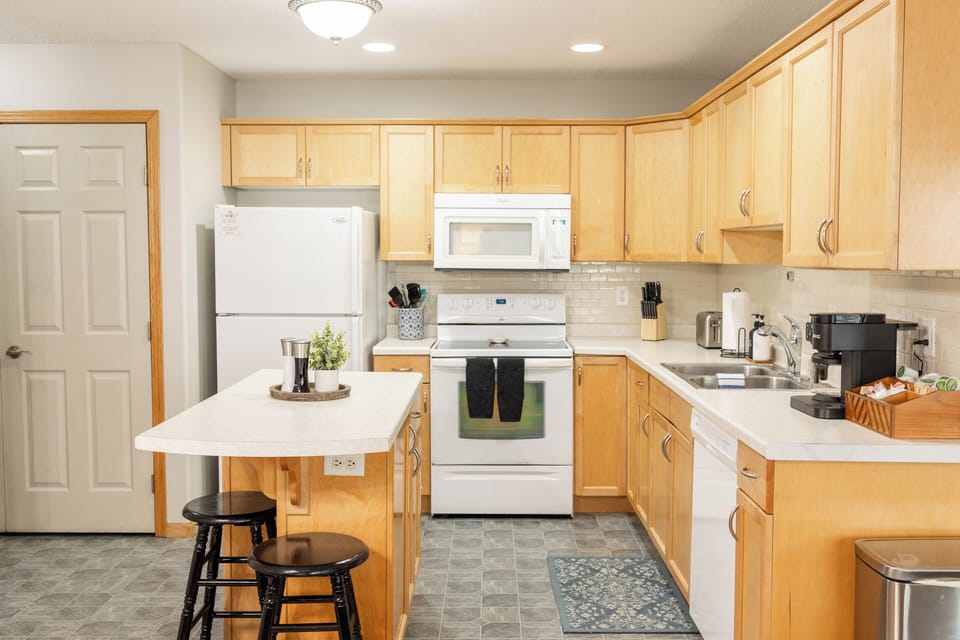Prepare meals at home in the clean and bright kitchen 