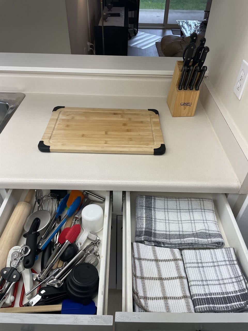 Lots of kitchen supplies and towels