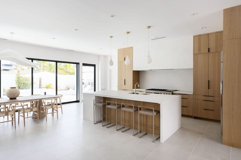 The chef’s kitchen is a culinary haven featuring luxury appliances