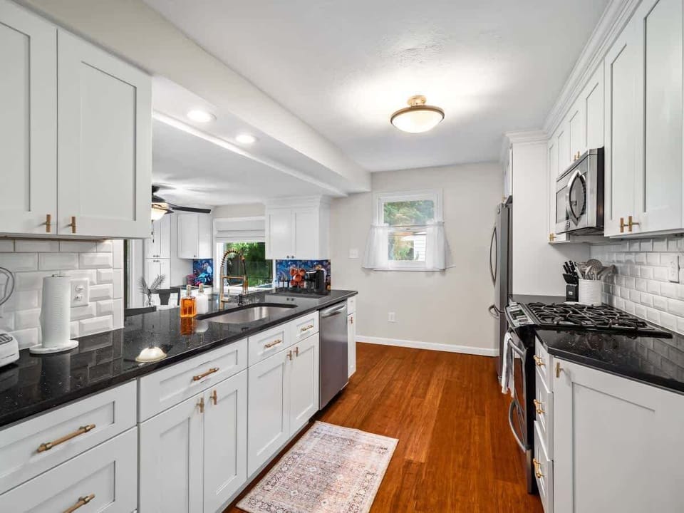 Bright kitchen w/ stainless appliances & ample counter space for easy cooking