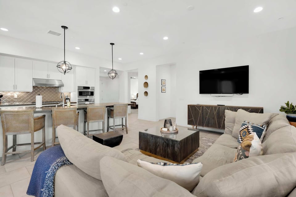 Spacious living space with ample seating, and Smart TV