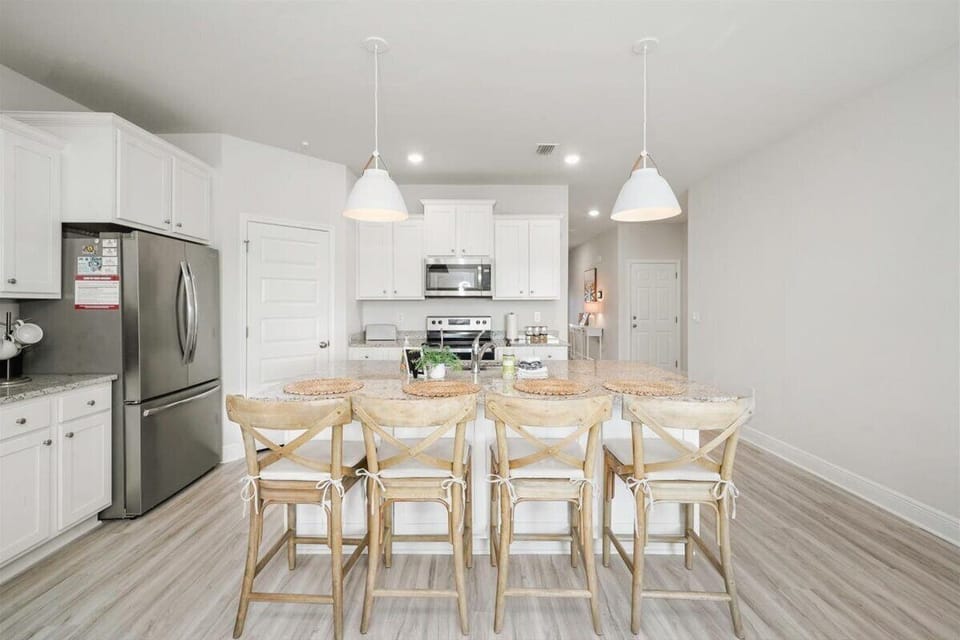 Fully stocked kitchen with island seating for 4