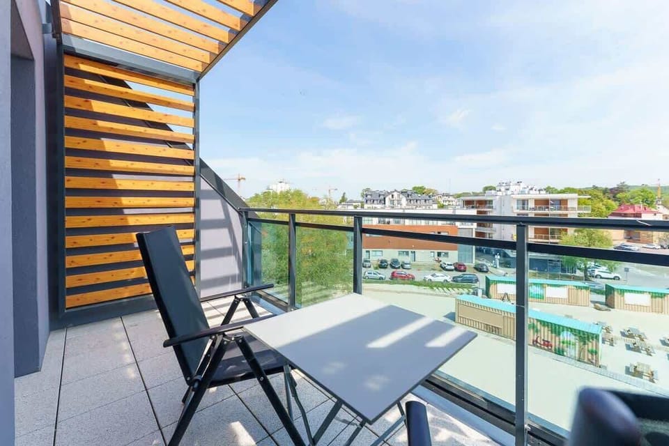 The balcony provides a perfect spot for enjoying the fresh air. 