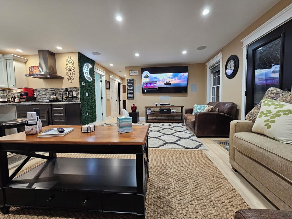 85" Articulating Samsung TV.  Open concept with kitchen.  11.2 surround sound.