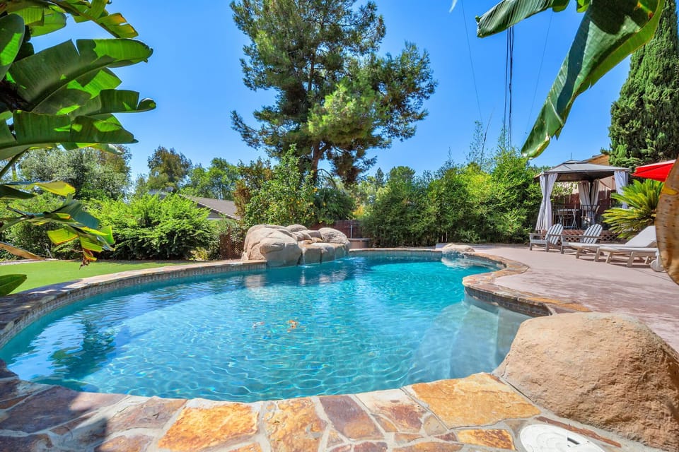 Enjoy a warm, inviting swim in a solar-heated saltwater pool. Relax, play, and unwind in this serene backyard oasis.