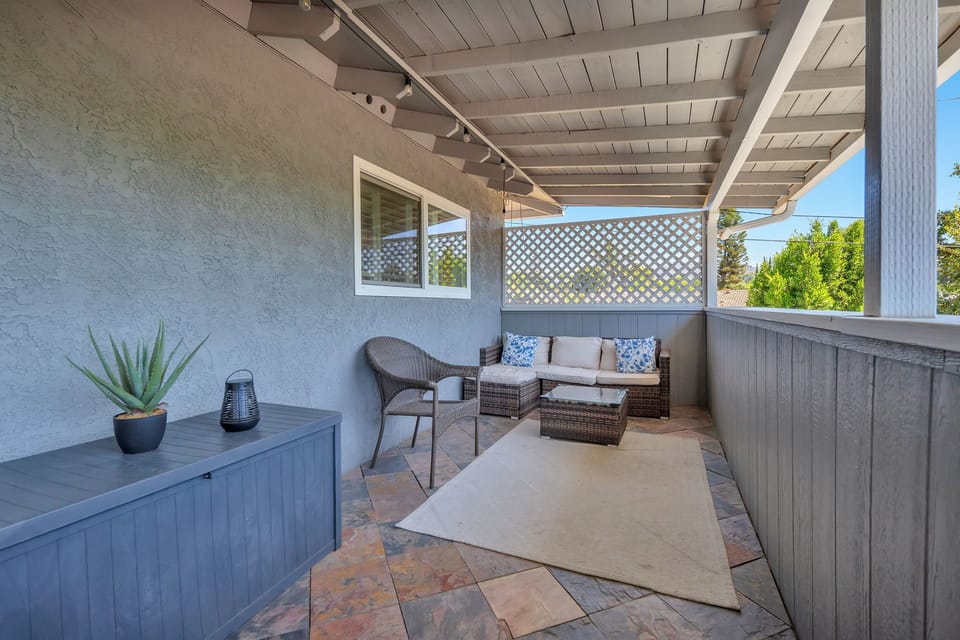 Step out onto the balcony off the kitchen, featuring comfortable seating for relaxing mornings, casual meals, or enjoying fresh air and scenic views.