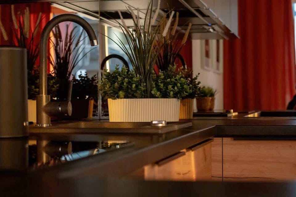 Warm-toned evening kitchen view with ambient lighting and décor.
