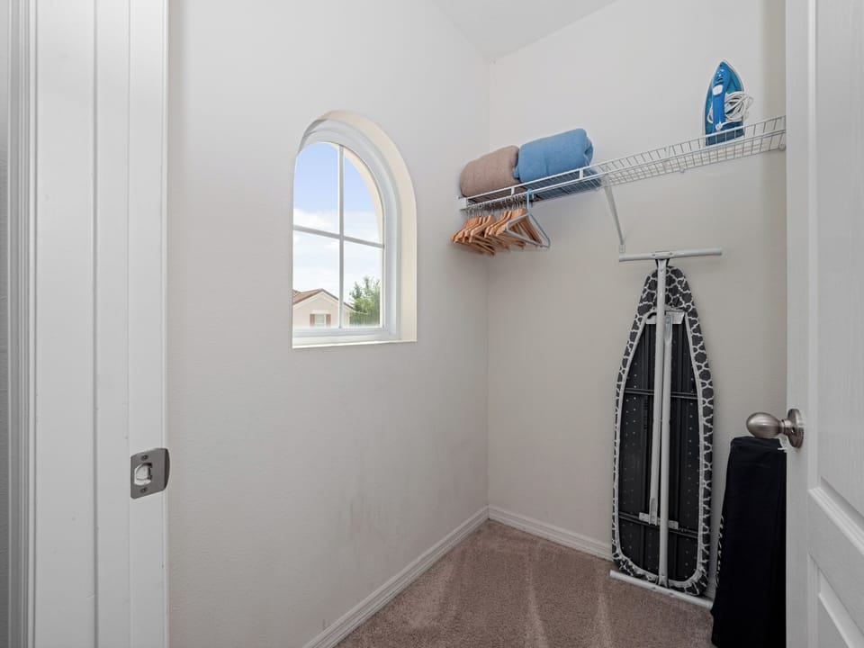 Convenient Closet with Iron/Ironing Board and Hangers