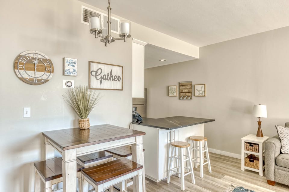 Gather around the cozy dining table, perfect for meals or hanging out. With extra seating at the breakfast bar, there's space for everyone to enjoy!
