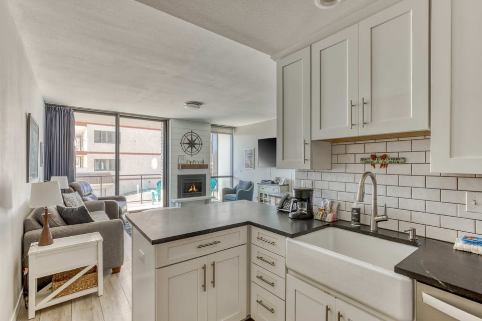 Cook with ease in our functional kitchen featuring essential appliances and a clean, practical layout for all your meal prep needs.