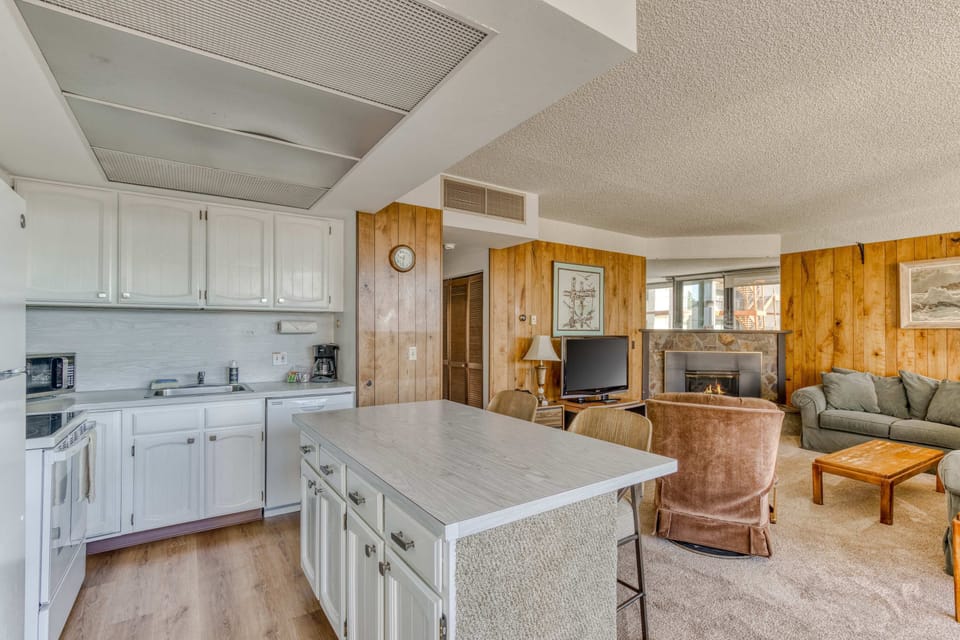 The island provides ample space to prep while also providing seating for company. Open floor plan means no one is missing out on the festivities!