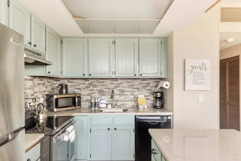 Functional kitchen providing essential appliances creating a clean and practical cooking space