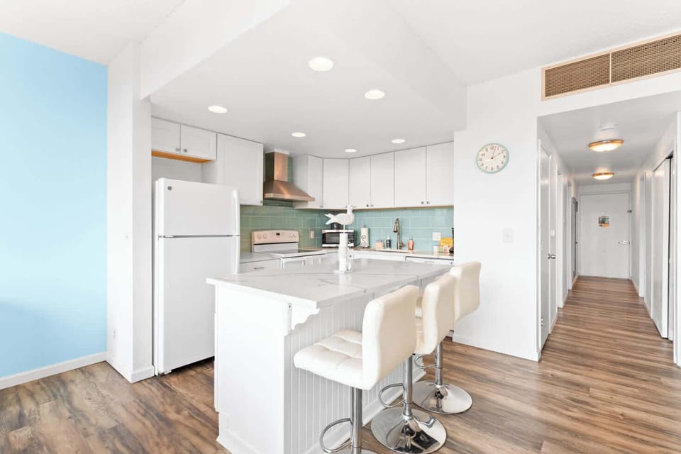Whip up delicious meals in this modern kitchen, then gather around the island! Perfect for easy entertaining. 