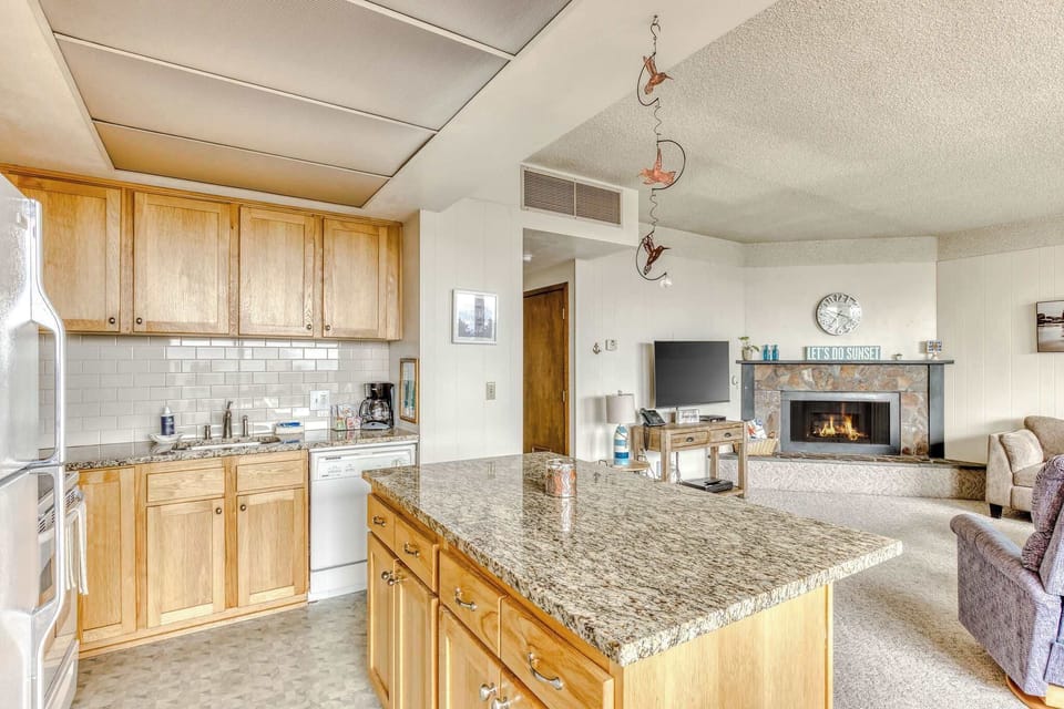 The island provides ample space to prep while also providing seating for company. Open floor plan means no one is missing out on the festivities!