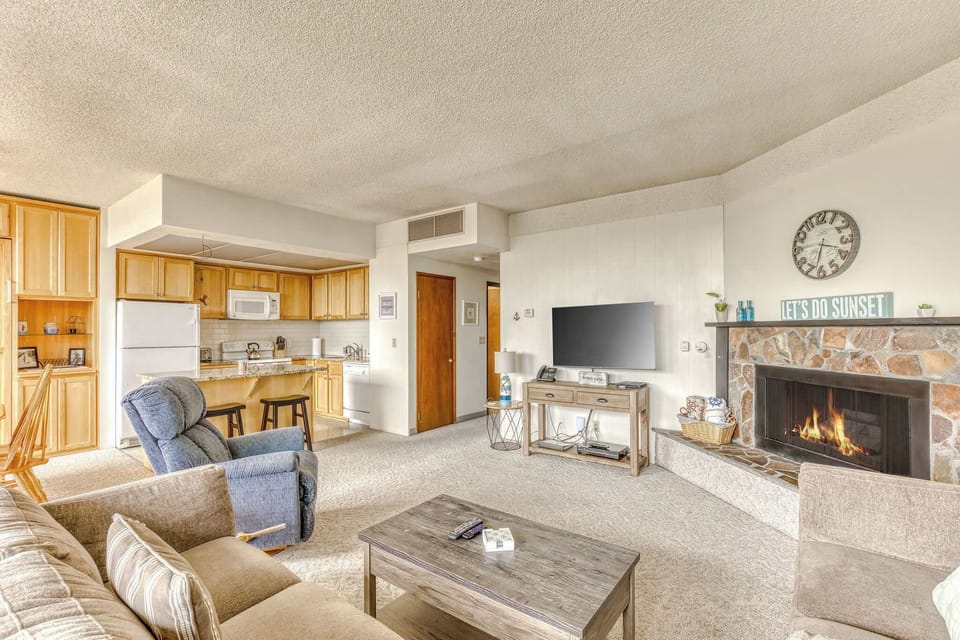 A modern, open-concept living space with large windows, cozy seating, a spacious dining area, and a bright, inviting atmosphere.