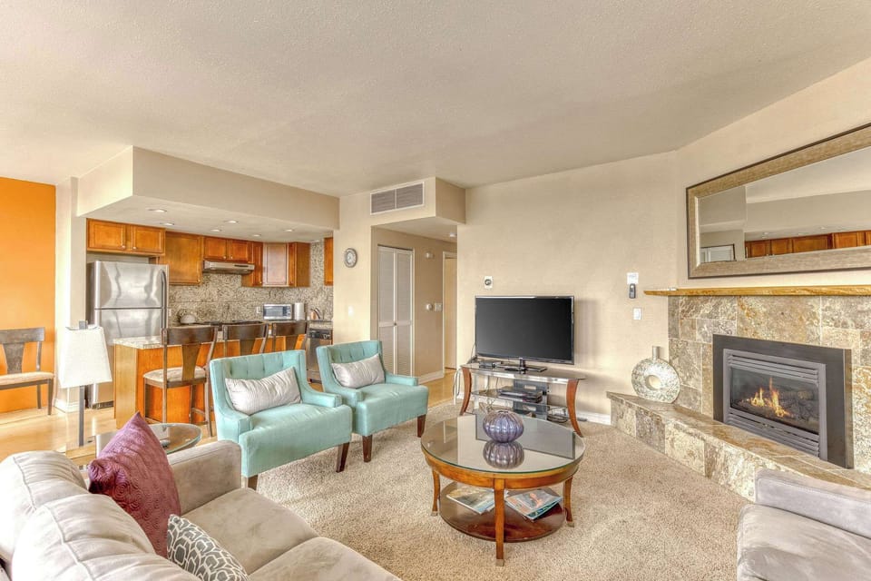 Gather and create memories in this bright and airy condo. Features comfortable seating, a spacious dining table, and a well-appointed kitchen perfect for entertaining with a view.