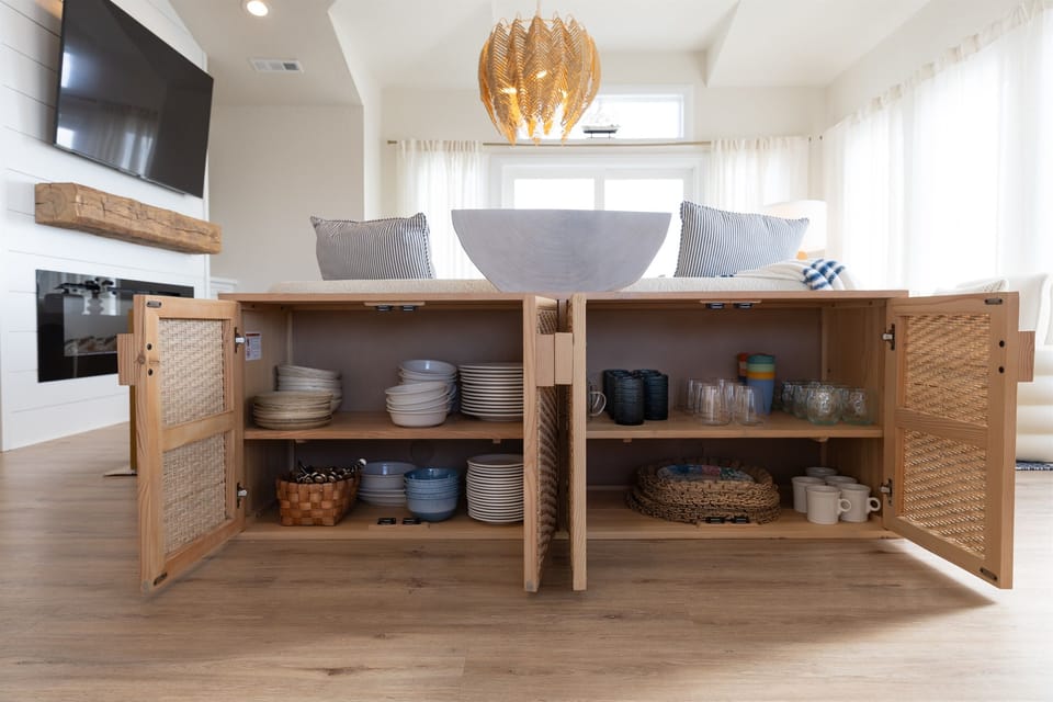 Plenty of plates and bowls for dining.