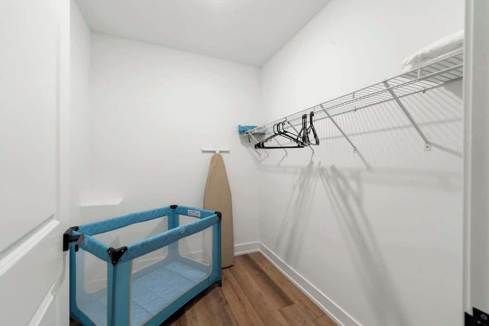 Tidy bathroom vanity w/ bright light & modern fixtures.