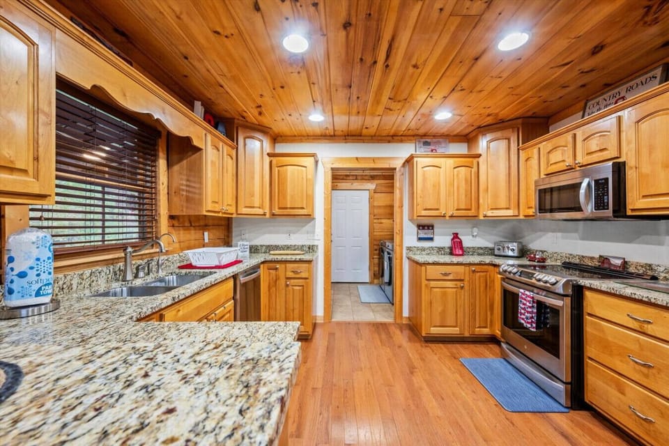 The kitchen is fully equipped with stainless steel appliances, cookware, bakeware, dishware, silverware and more.
