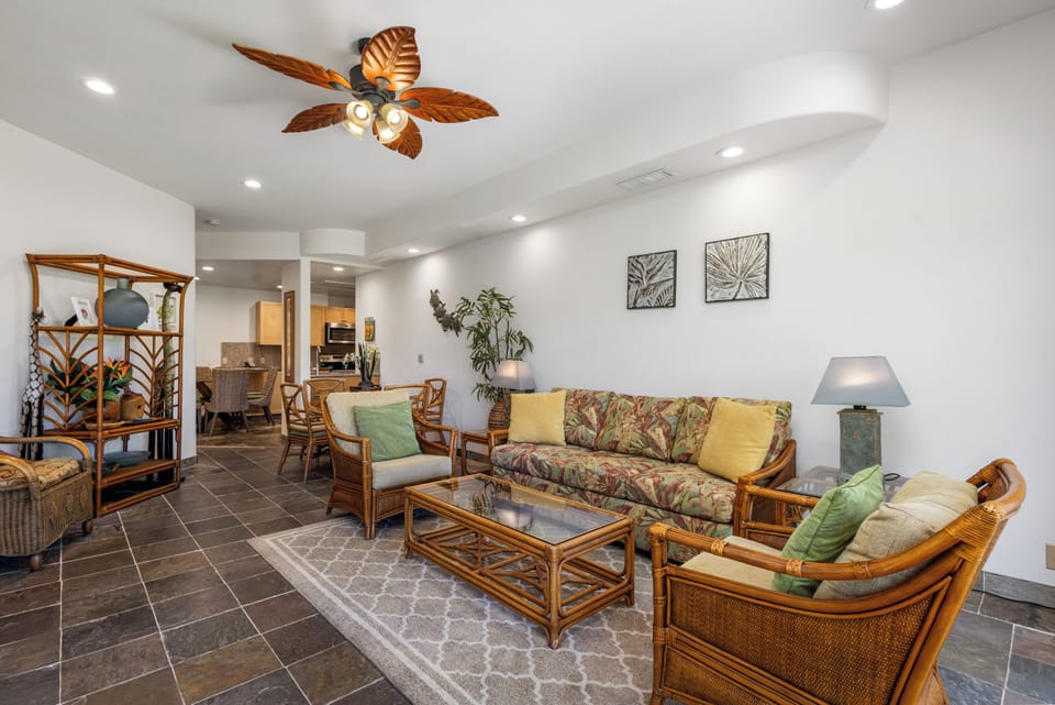 Settle into breezy tropical comfort with island-inspired décor, plush seating, and a stylish ceiling fan that keeps you cool while you unwind in your vacation haven.