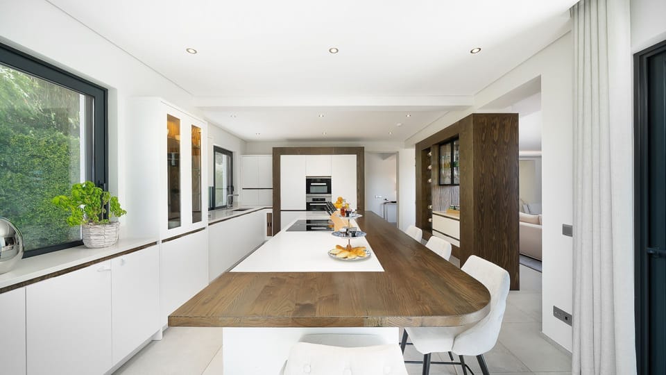 This bright and spacious kitchen is perfect for culinary creativity, offering a sleek island, modern appliances, and a cozy breakfast bar. 

#LuxuryKitchen #ModernLiving #Algarve #Portugal