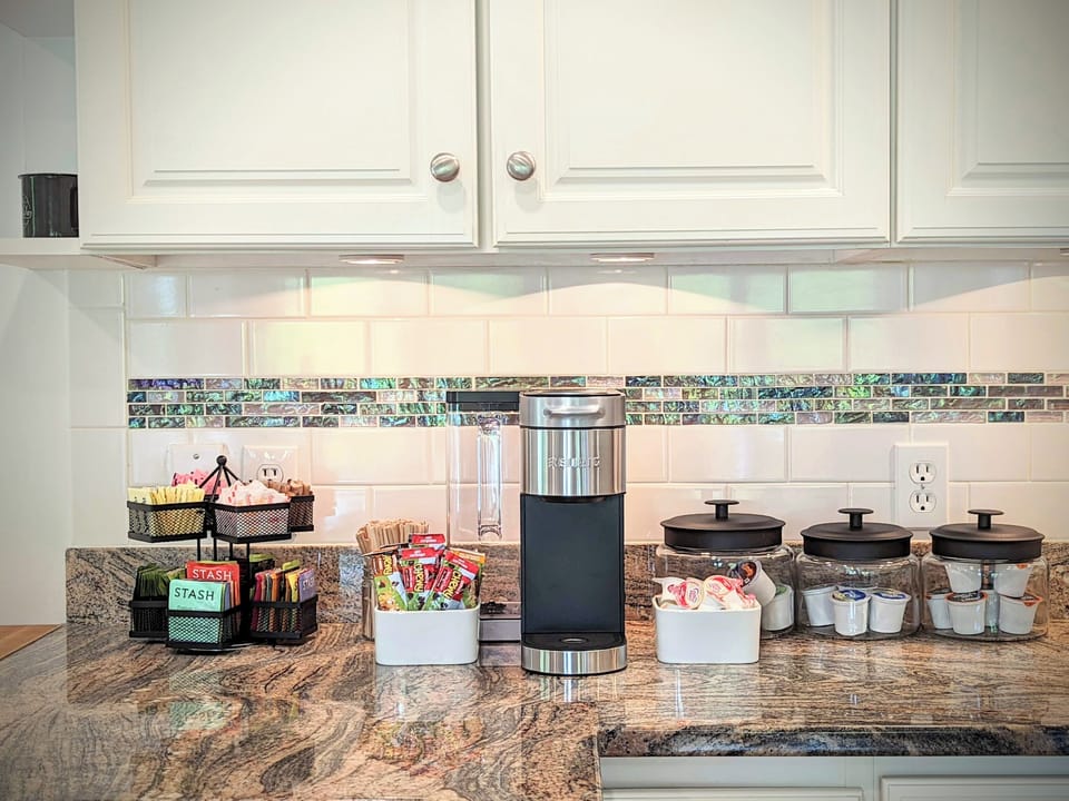 The kitchen coffee station with assorted coffees, teas, & snacks.