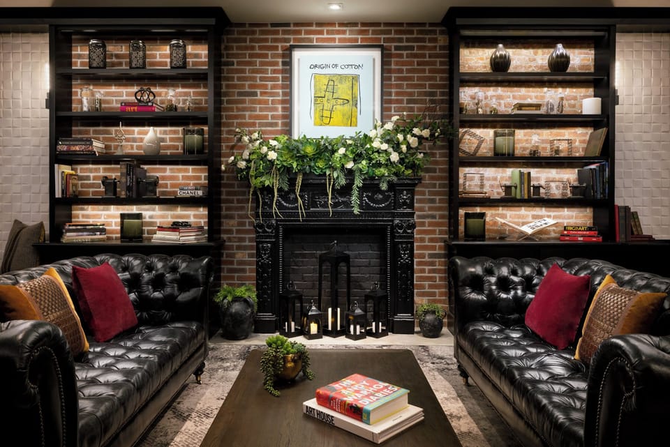 Unwind by the glowing fireplace with plush leather seating.