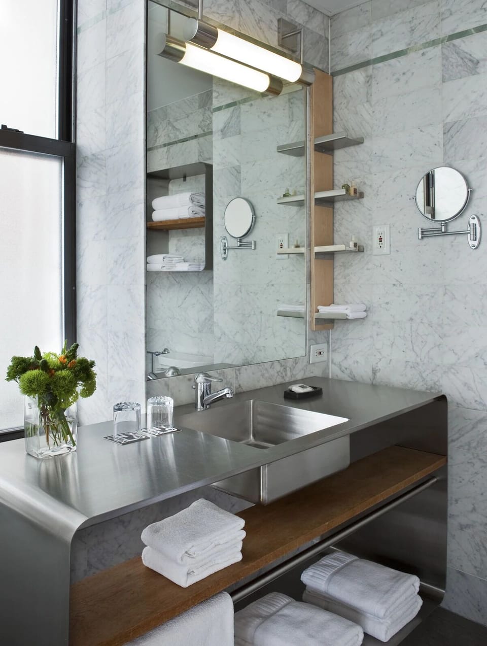 Refresh in a spa-like marble bath with plush towels.