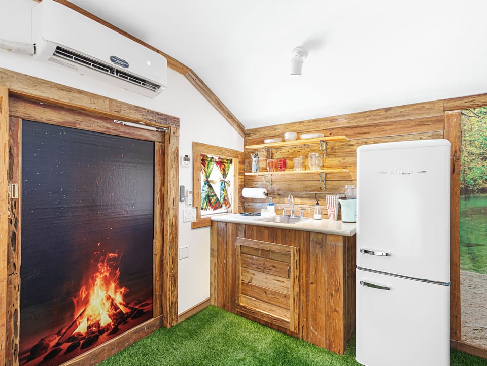 Movie theater kitchenette, popcorn maker, retro fridge freezer, sink, plates