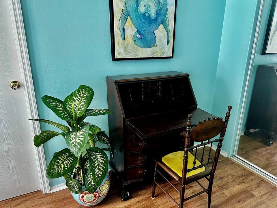 Antique desk workspace in king bedroom