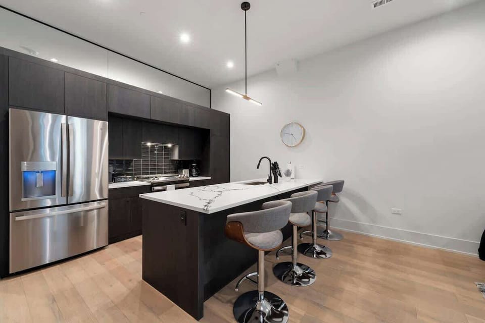 Bright kitchen w/ sleek cabinets & open prep space.