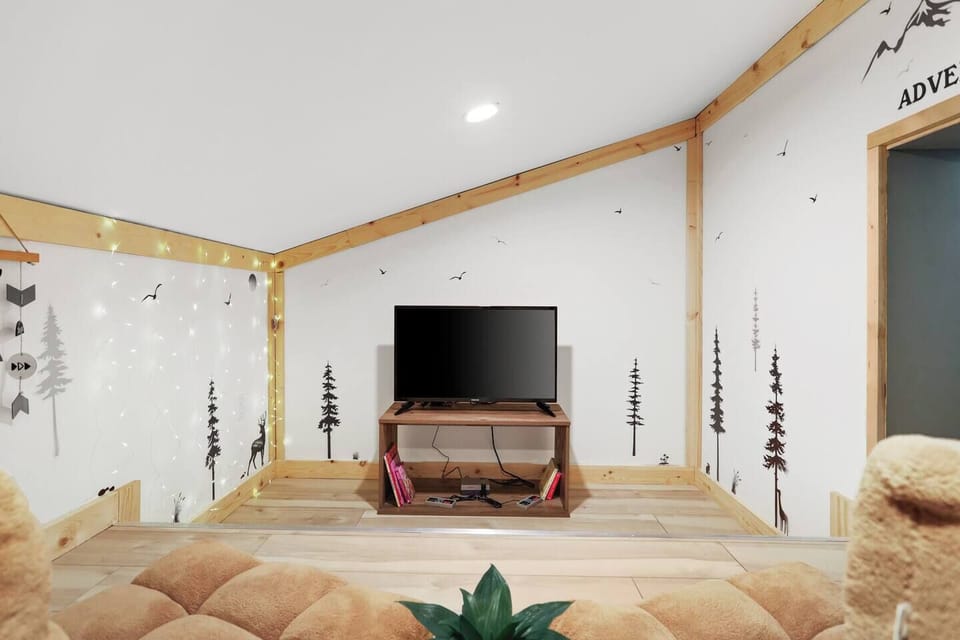 At the heart of the nook, a smart TV is cleverly integrated into the design, ready to transport young adventurers on digital journeys. Whether they're exploring educational programs, watching their favorite shows, or embarking on virtual adventures.