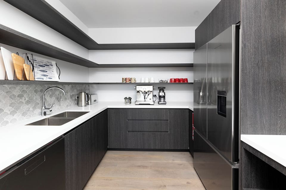 Butler's pantry, complete with coffee machine, and 1 of 3 dishwashers