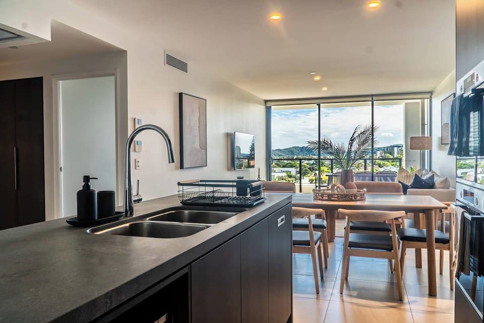 Enjoy the seamless open-plan layout that effortlessly connects the kitchen, dining, living area, and balcony.






