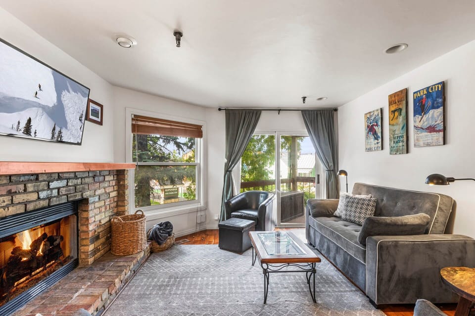 Vacation Rentals in Park City at Ski Team 1: Living room - wood-burning fireplace, sofa and TV