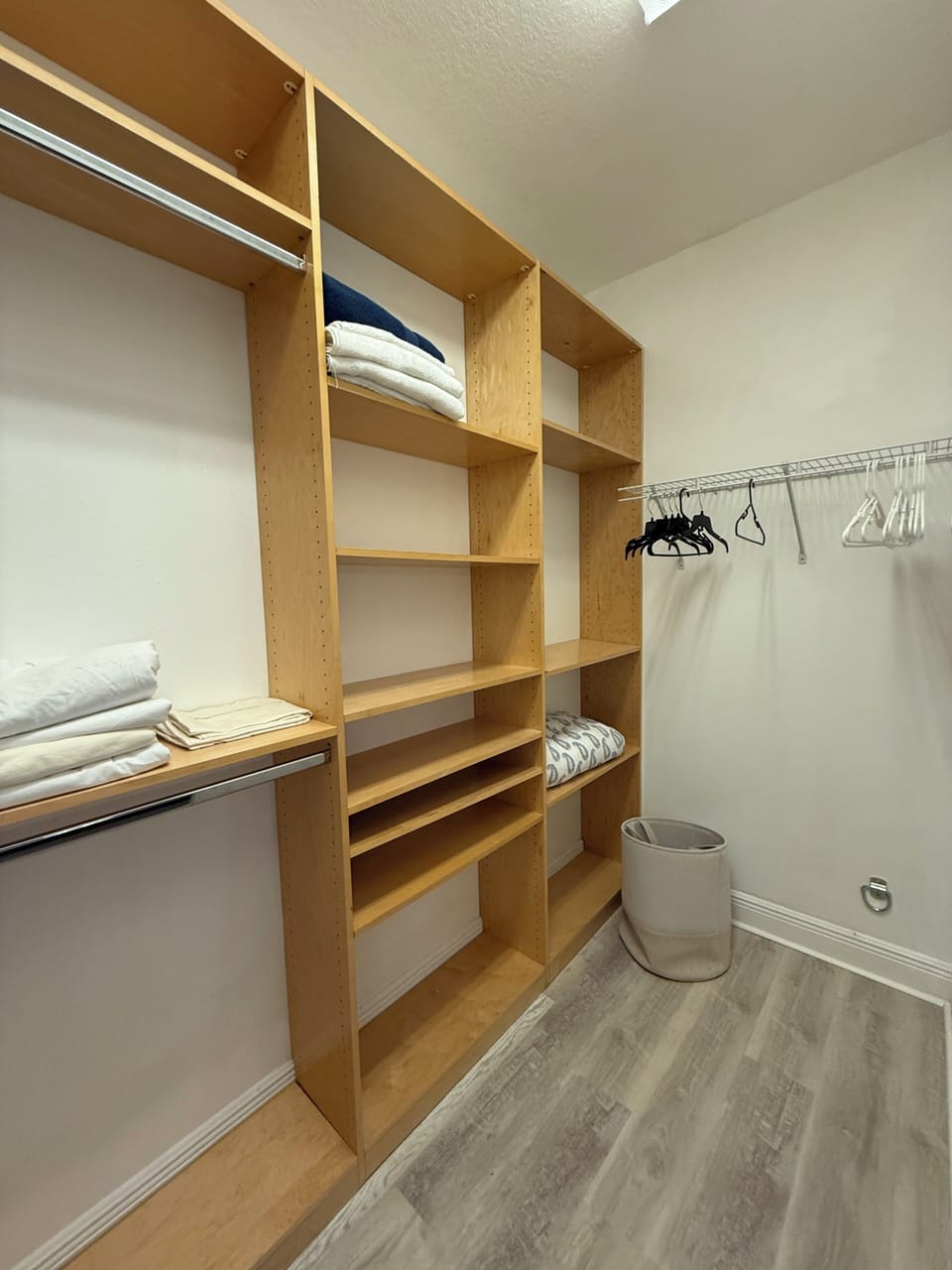 Secondary walk in closet with custom shelving