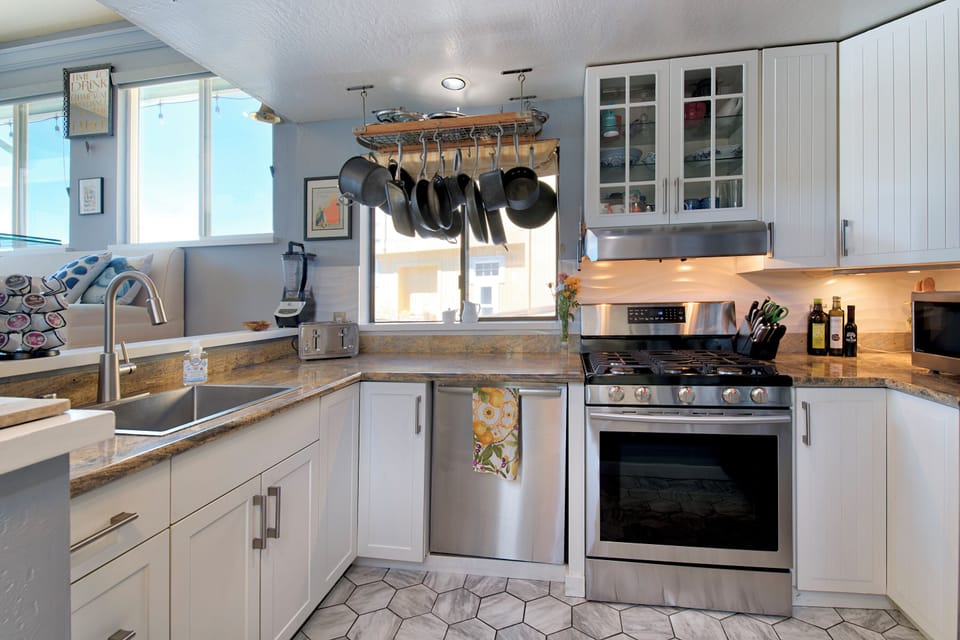 Open Kitchen with silent Miele dishwasher, granite counters and more