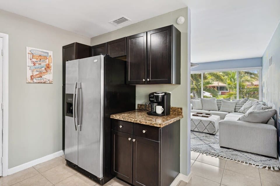 Whip up culinary delights in our fully stocked kitchen, complete with stainless steel appliances for a touch of elegance!